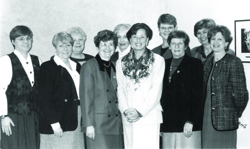 Celebrating NP legislation with then health minister Elizabeth Witmer (front row, third from right) are  (L to R): Carol Sargo, past president, NPAO, Joanne Mousseau, former nursing consultant to the ministry of health on the NP initiative, Barbara Thornber, ED, RPNAO, Charlotte Noesgaard, RNAO president, Margaret Risk, ED, CNO, Sue Williams, director of the school of nursing at Ryerson Polytechnic University, Petra Cooke, president, CNO, Barb Wahl, president, ONA, and Doris Grinspun, ED, RNAO. 