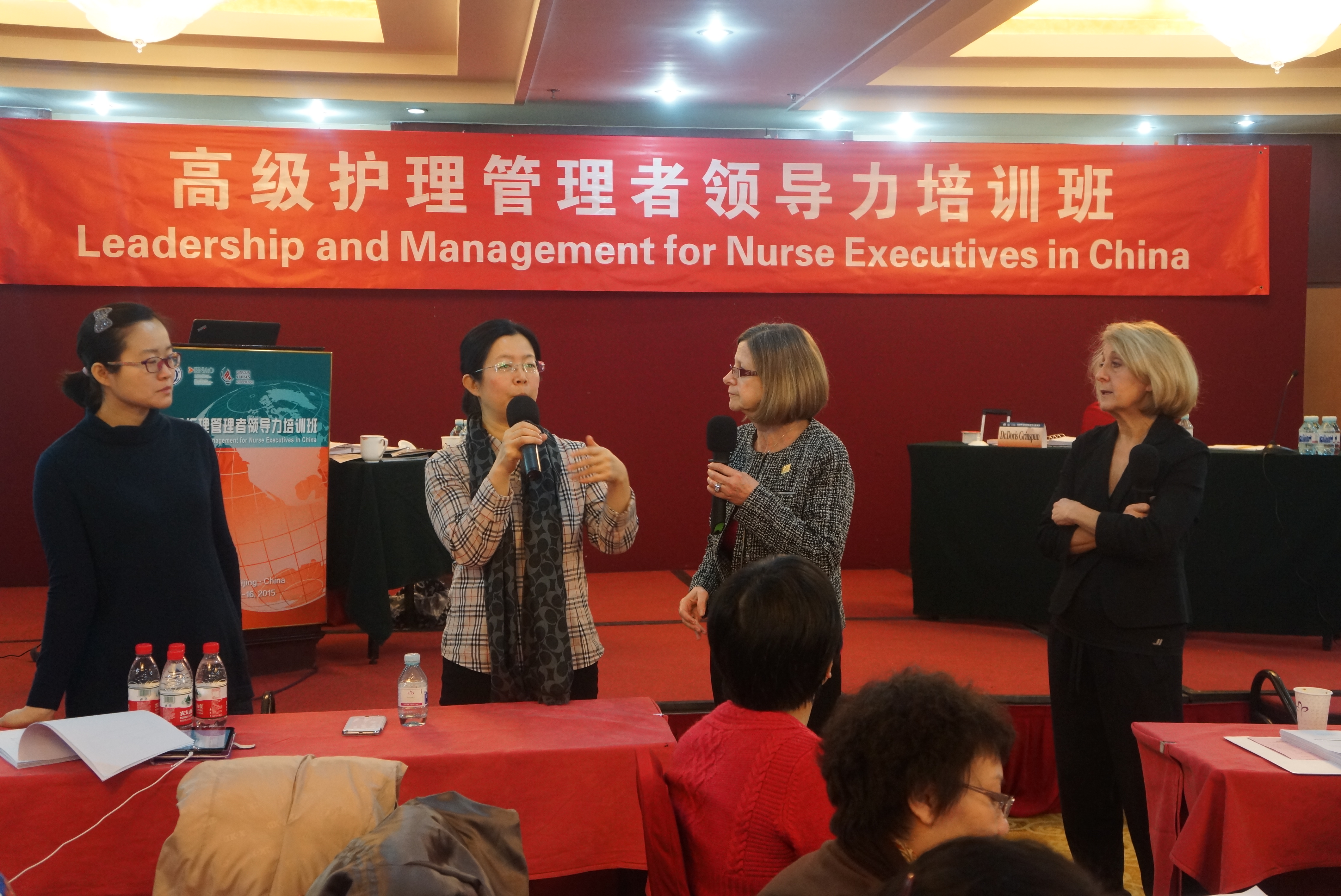 Grinspun (second from right) and Dr. Irmajean Bajnok (right) host leadership training sessions in China.