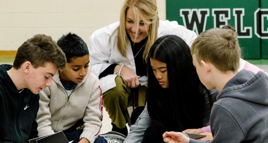 Public health nurse Cindy Baker-Barill speaks with students about vaping