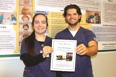 Nursing students Stephanie Williams and Derion Ducedre promote Boxes and Blankets in advance of participating in the fundraiser this past September. 