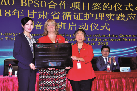 IABPG Associate Director Heather McConnell (centre) and Toronto Public Health BPSO co-ordinator May Tao (right) present Central China’s Lanzou University CNE Sally Dou (left) with a plaque to mark the beginning of its orientation as a BPSO. 