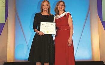 RNAO CEO Doris Grinspun (right) inducted as an honourary academy fellow of the American Academy of Nursing