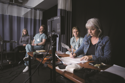 Centennial graduate Renee Shugg (second from right) participates in simulation games alongside (from left) Centennial College nursing professor Michelle Hughes, street nurse Logan Tullett, and Centennial College nursing professor Margaret Verkuyl.