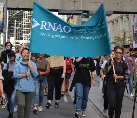 RNAO members Elaine Wang (left) and Nicole Deziel (right) hoist the RNAO banner as they march with thousands of other Torontonians concerned about the future of our planet. The rally – or Climate Strike as it was called – took place in cities across the country on Sept 27. Other RNAO members, including staff, joined what RNAO CEO Doris Grinspun referred to as “…the most important fight of our generation for the health and very existence of future generations.”