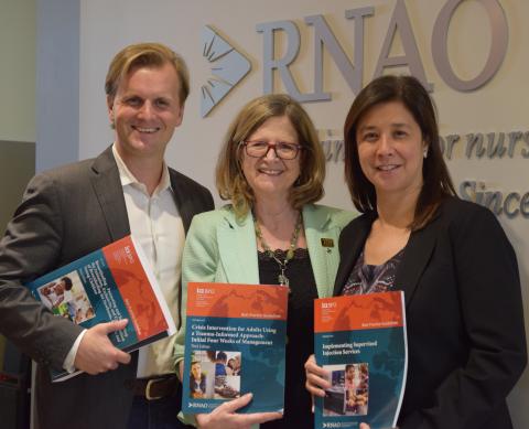 Toronto municipal councillor and board of health chair Joe Cressy (left), along with the city’s medical officer of health Eileen de Villa (right), visited RNAO CEO Doris Grinspun on Sept. 19, the same day the pair made public their recommendation that the province consider preventing parents from exempting their children from vaccines on philosophical or religious grounds. Their recommendation was passed by the board of health on Sept. 23.