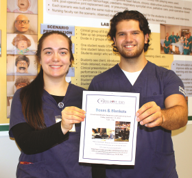 Nursing students Stephanie Williams and Derion Ducedre promote Boxes and Blankets in advance of participating in the fundraiser this past September. 