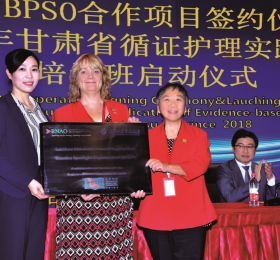 IABPG Associate Director Heather McConnell (centre) and Toronto Public Health BPSO co-ordinator May Tao (right) present Central China’s Lanzou University CNE Sally Dou (left) with a plaque to mark the beginning of its orientation as a BPSO. 