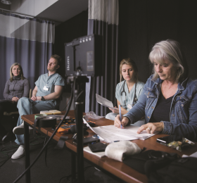 Centennial graduate Renee Shugg (second from right) participates in simulation games alongside (from left) Centennial College nursing professor Michelle Hughes, street nurse Logan Tullett, and Centennial College nursing professor Margaret Verkuyl.