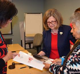 Carmen Jones, Director of Health for the Chiefs of Ontario (left), and RNAO CEO Doris Grinspun watch as Elder Shirley Williams blesses the partnership between the two organizations, officially signed on Sept. 13. Representatives from the Indigenous community and the Chiefs of Ontario were invited to RNAO’s September assembly meeting to share their personal experiences with the health system, and what the partnership will mean for Indigenous peoples in Ontario. 